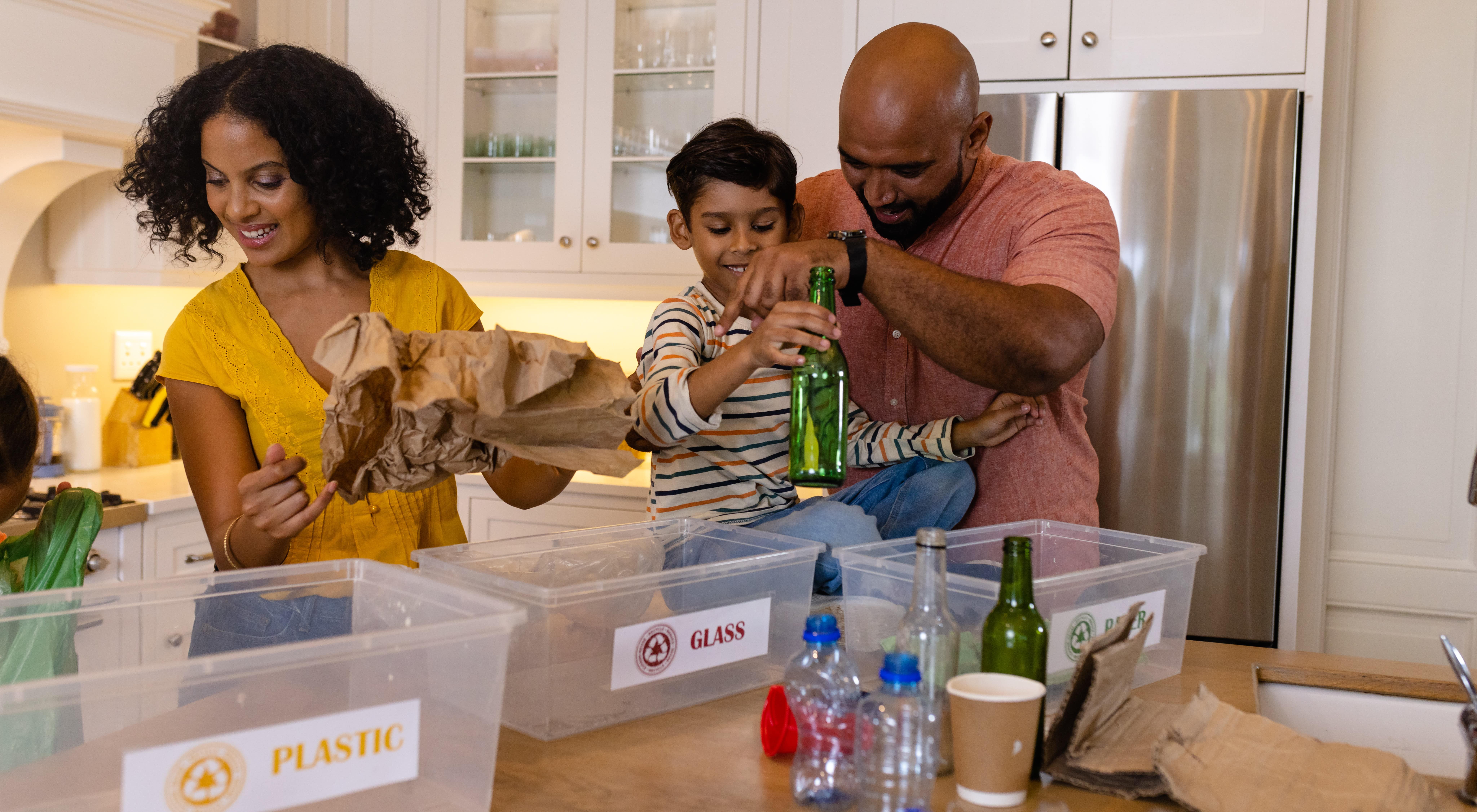 family recycling and practicing eco friendly habits together 